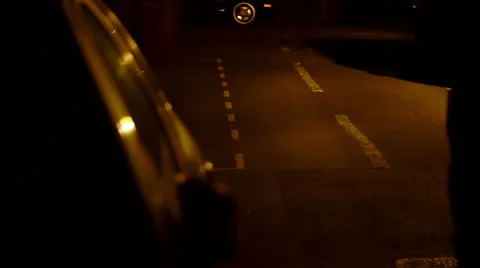 Man victim of a thief try to follow him running along a dark and bad illuminated Stock Footage 59938976