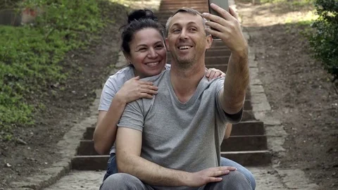 Man in Video Call on Outdoor Steps Woman Approaches Stock Footage 74061302