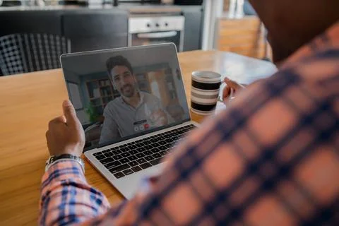 Man on a video call from work. Stock Photos