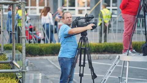 Man with video camera in city Stock Footage 121506588