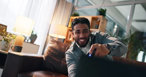 Man, video game and controller on couch for fist pump, challenge and esports Stock Footage 314093751