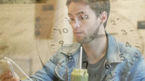 Man viewing tech content, reacting and checking drink straw, clock overlay Stock Footage 330331214