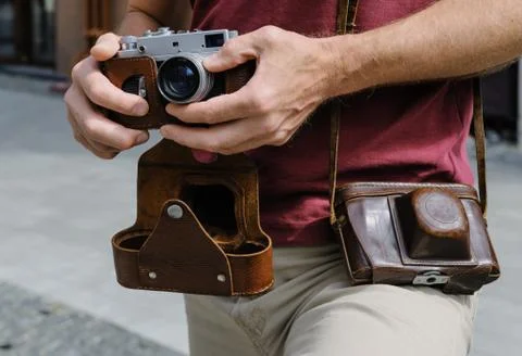A man with a vintage camera. Stock Photos