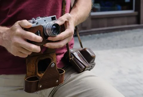 A man with a vintage camera. Stock Photos