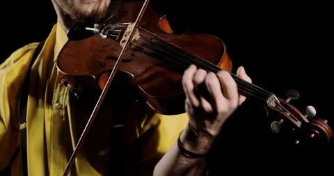 Man violist playing on alt or violin on black background, instrument closeup. Stock Footage 120840927