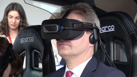 Man in virtual glasses headset testing Vodafone 5G-based communications systems Stock Footage 74108830