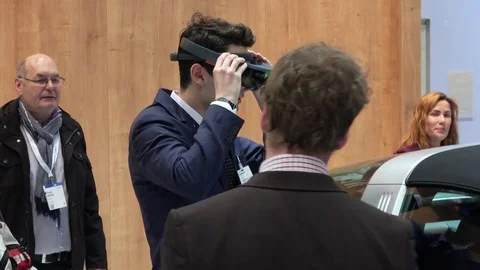 Man in virtual glasses headset testing 5G-based communications systems for Stock Footage 74571872