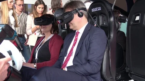 Man in virtual glasses headset testing Vodafone 5G-based communications systems Stock Footage 76328260