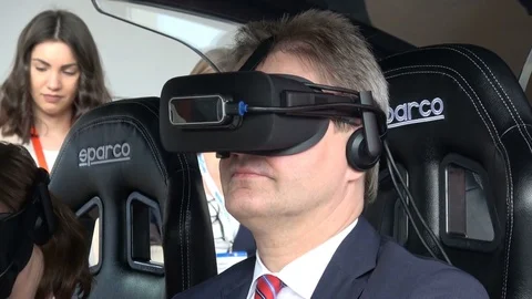 Man in virtual glasses headset testing Vodafone 5G-based communications systems Stock Footage 80998560