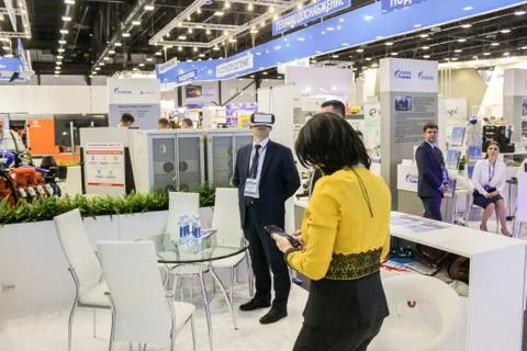 A man in virtual glasses at the table. Stock Photos