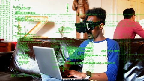 Man in virtual goggles using a laptop Stock Footage 107667672
