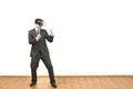The man in a virtual reality glasses fighting on a white wall background Photo