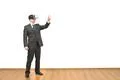 The man with a virtual reality glasses gesturing on the white wall background Photo