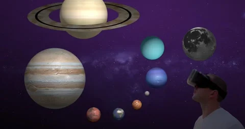 Man in virtual reality glasses looks at a hologram of the  planets. Stock Footage 331863250