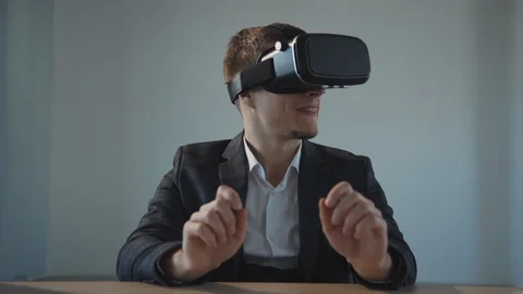 Man in virtual reality glasses making smiling face 스톡 동영상 119462576
