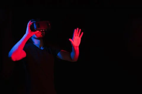 A man in virtual reality glasses is in a simulation Stock Photos