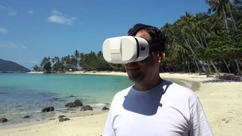 Man in Virtual Reality Glasses Walking by the Sea Stock Footage 73931920