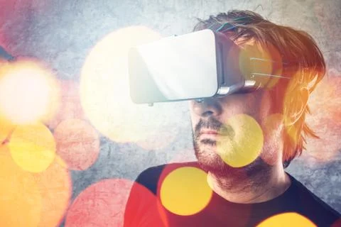 Man with virtual reality goggles watching 3d VR multimedia content Foto stock