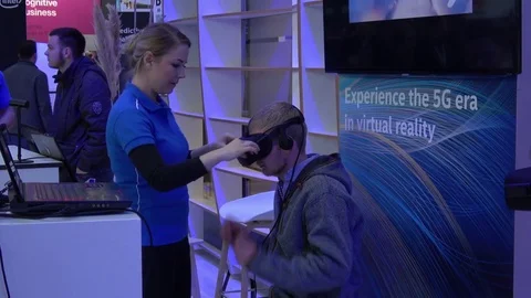 Man in virtual reality headset. Experience the 5G area in virtual reality on Stock Footage 74572512