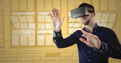 Man in virtual reality headset hands out against yellow hand drawn windows 스톡 사진
