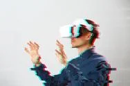 Man With Virtual Reality Headset Is Playing Game. Image With Glitch Effect. Stock Photos