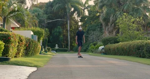 Man in virtual reality headset riding skateboard outdoor. Stock Footage 271219612