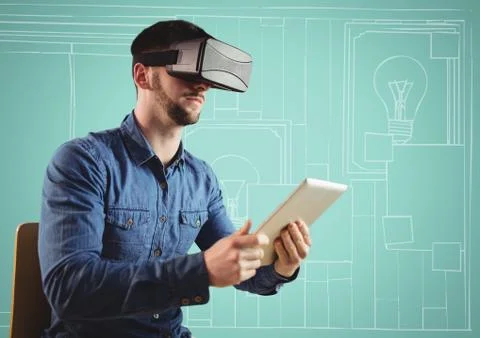 Man in virtual reality headset with tablet against aqua and white hand drawn 库存照片