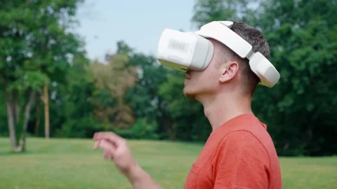 Man in a virtual reality helmet controls gestures. Stock Footage 135643105