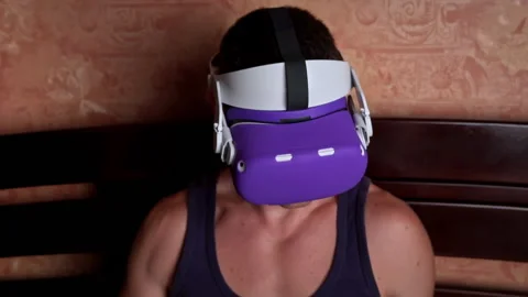 Man in a Virtual Reality Helmet Controls the Controllers Stock Footage 201207817