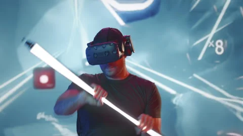 A Man In A Virtual Reality Helmet Holding A Light Saber In His Hands Constructio 스톡 동영상 259297570