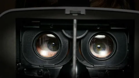 Man in a virtual reality mask looks around. Inside. Stock Footage 66497694
