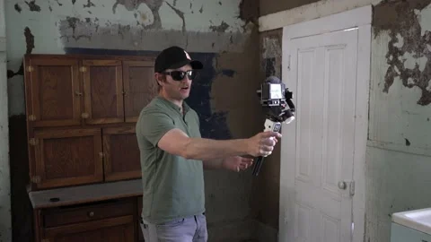 A man vlogging inside an old building Stock Footage 239391873