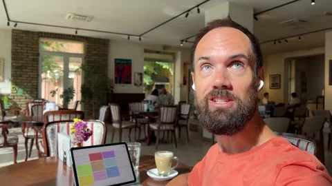 Man Vlogging or Creating Content in a Cafe Stock Footage 316951995