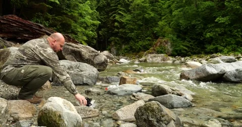 Man voluntarily taking out plastic waste from the river left by others Stock Footage 200621246