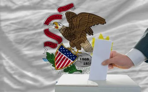 Man voting on elections in front of flag us state flag of illinois Stock Photos