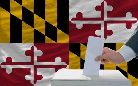 Man voting on elections in front of flag us state flag of maryland Stock Photos