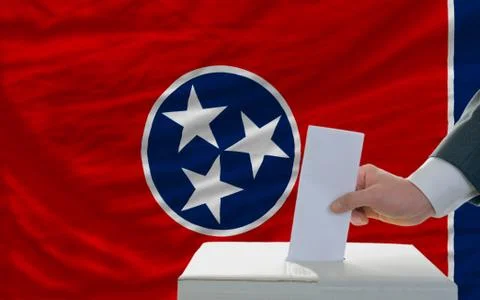 Man voting on elections in front of flag us state flag of tennessee Stock Photos