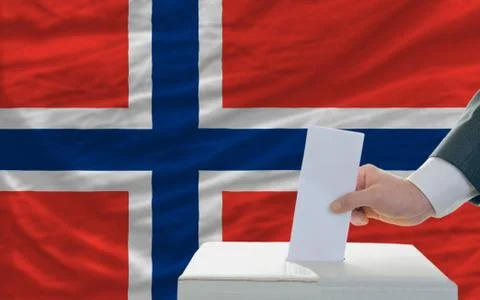Man voting on elections in norway in front of flag Stock Photos