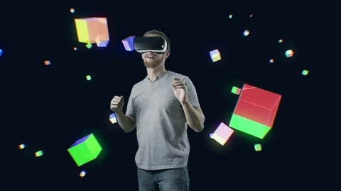 Man with VR gear glasses within interactive space touch virtual cubes Stock Footage 70152817