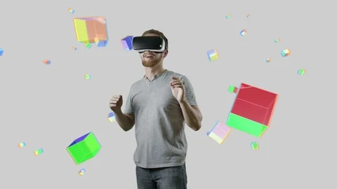 Man with VR gear glasses within interactive space touch virtual cubes Stock Footage 70152980