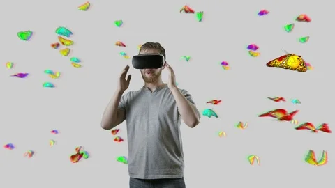 Man with VR gear glasses within butterfly cloud interactive touch virtual Stock Footage 71500003