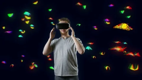 Man with VR gear glasses within butterfly cloud interactive touch virtual Stock Footage 71500559