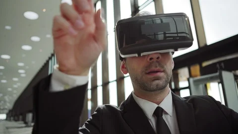 Man in VR glasses exploring and swiping data Video stock 108682568