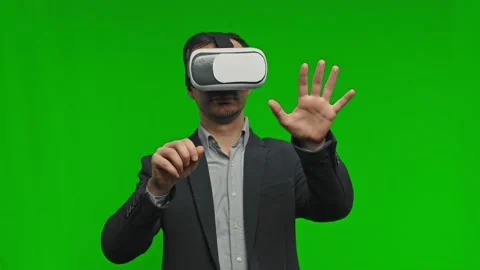 Man in vr glasses, playing video games with virtual reality headset, trying to Stock Footage 169864986