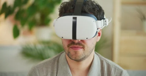 Man in VR Glasses Watches Documents Stock Footage 275822622