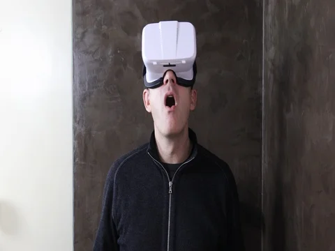 Man with VR goggles astonished Stock Footage 73103602