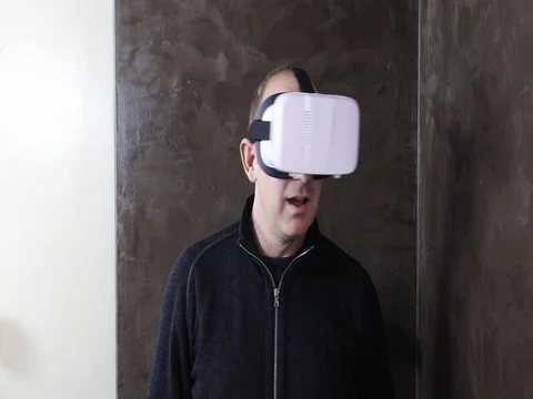 Man with VR goggles navigating menus Stock Footage 73103753