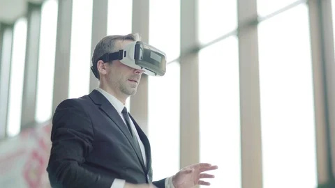Man in VR goggles swiping data Stock Footage 108681835