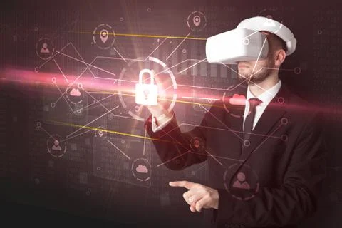 Man with VR goggles unlocking 3D network concept Stock Photos