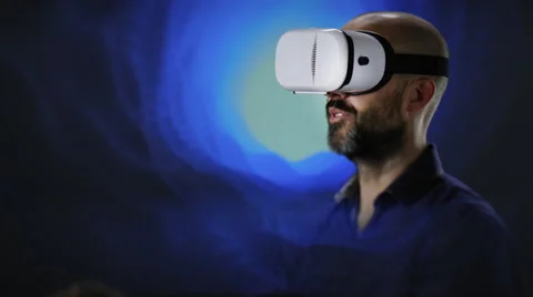 Man with VR headet trying to touch something Stock Footage 62788394